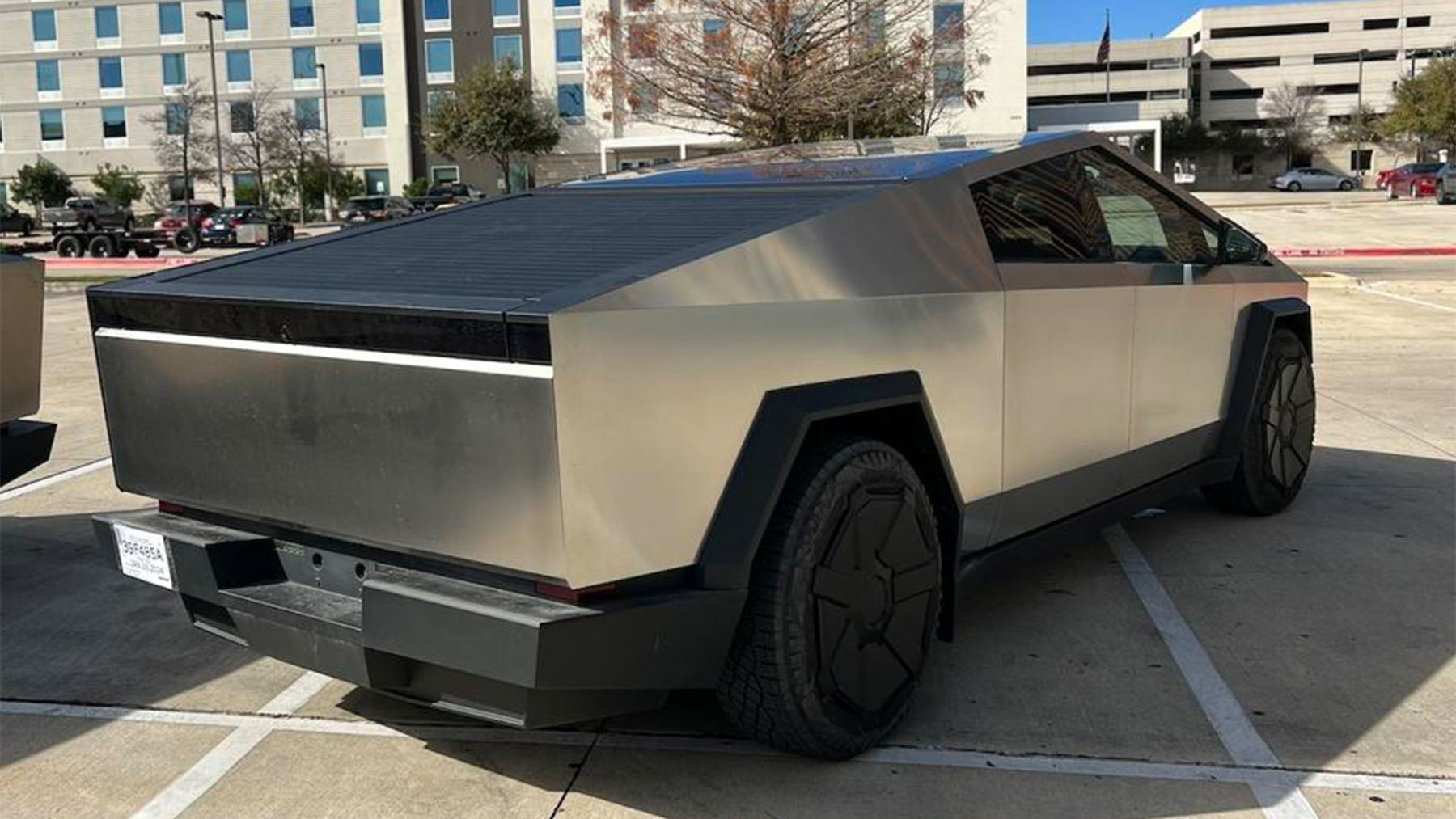 The owner of a Tesla Cybertruck discovers that it does not fit in his parking space, and Tesla threatens him with a $50,000 fine if he attempts to sell it within a year